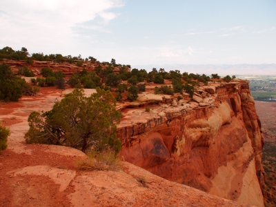 [A flat-topped section of land with a near vertical drop off on one side--nothing to stop a fall until you hit the canyon floor.]